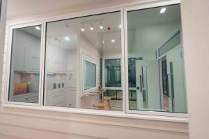 White aluminium awning window in a modern kitchen setting